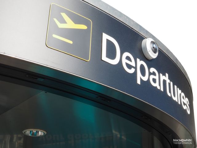 Airports in Toledo, Ohio with Departures Sign Symbolizing Seamless Travel Services.