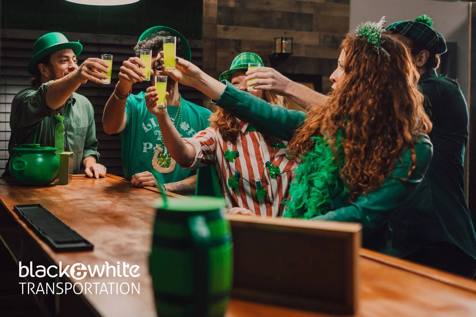 Friends Toasting Green Drinks at a Downtown Bar During St. Patrick’s Day 2026 Celebration