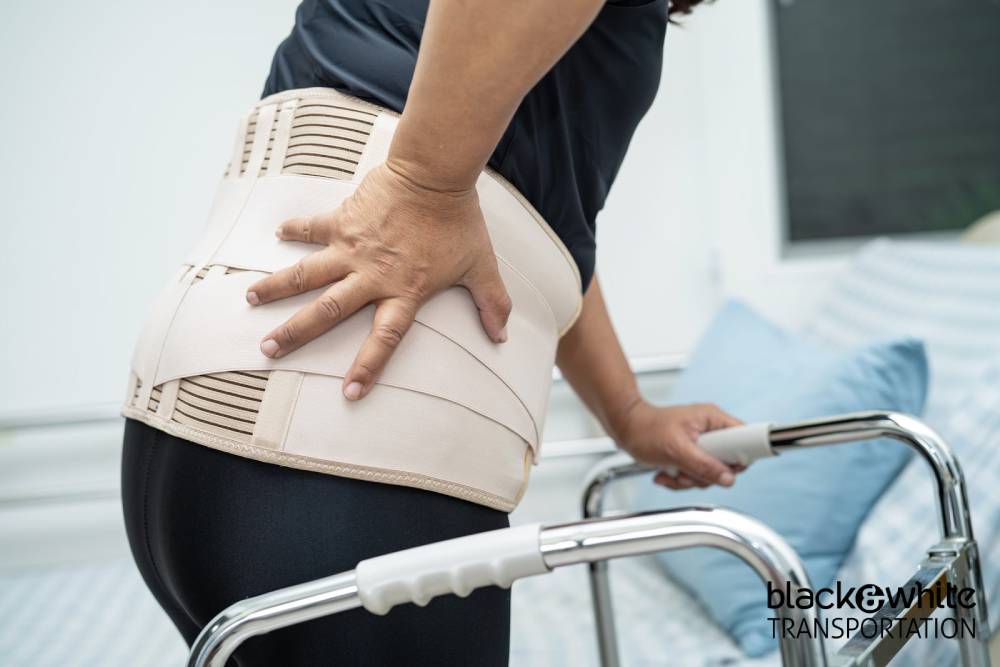 Patient with Back Brace Using a Walker
