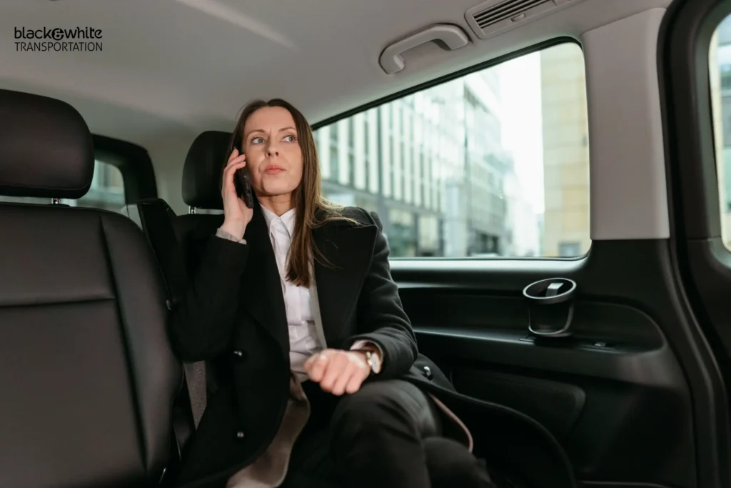 Business Traveler Taking a Call in Private Car