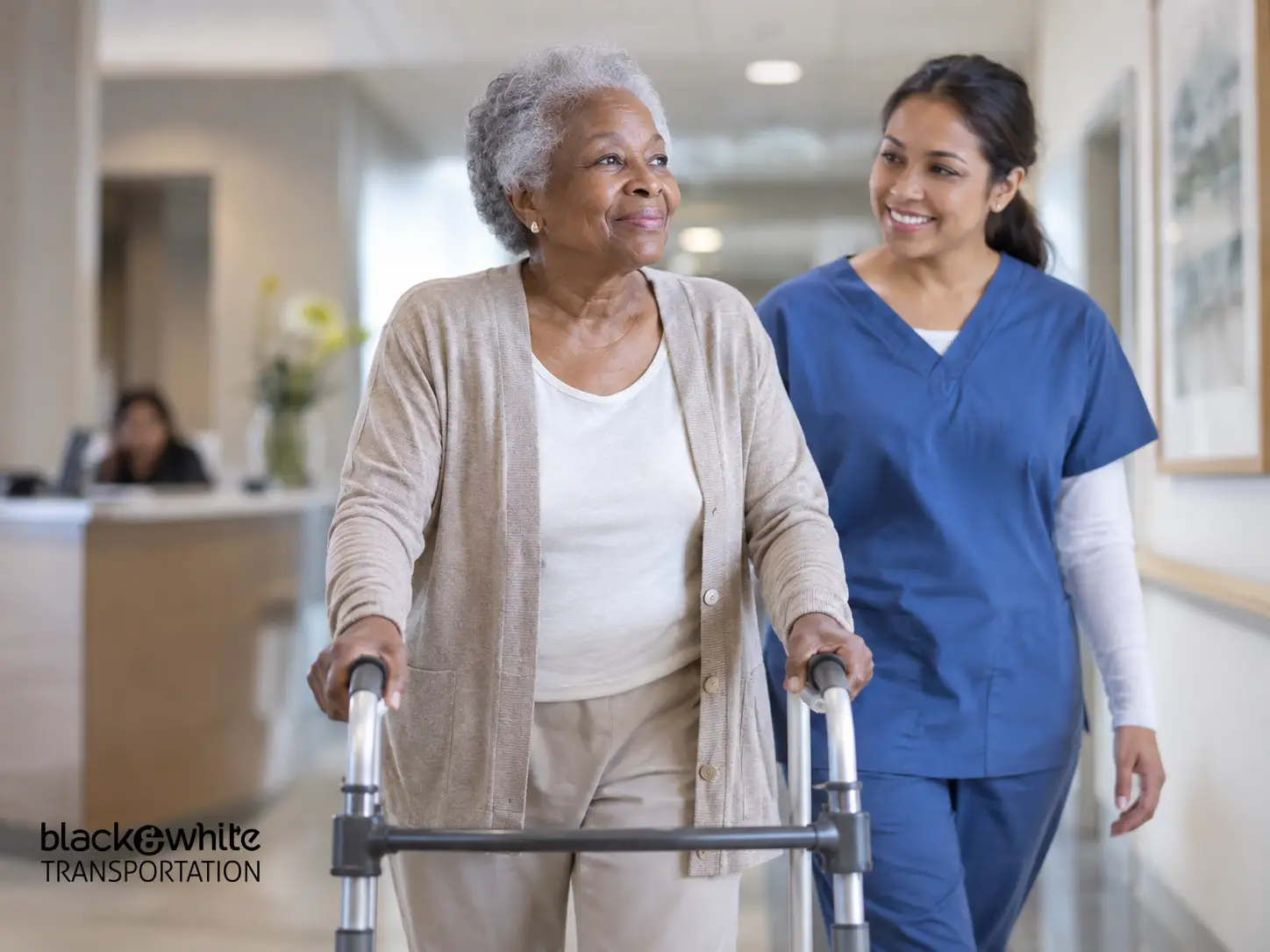 Older Adult Using Walker with Healthcare Worker