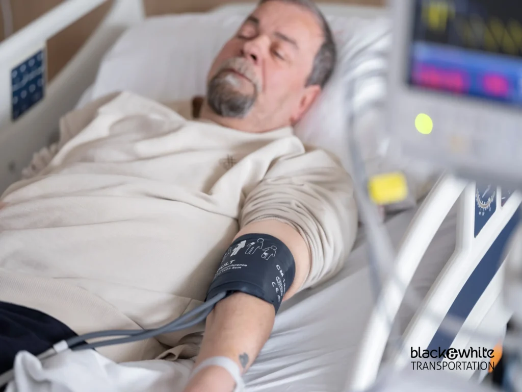 Patient Resting in Hospital Bed with Blood Pressure Cuff